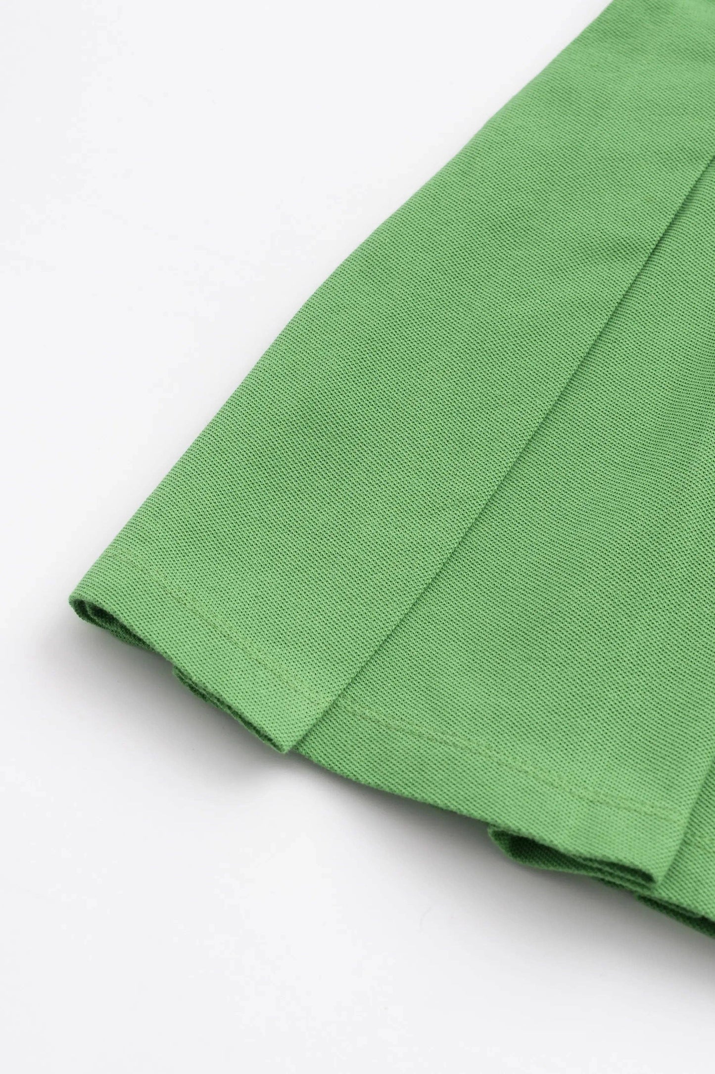 Golf Clubs on Green Pleated Tennis Dress