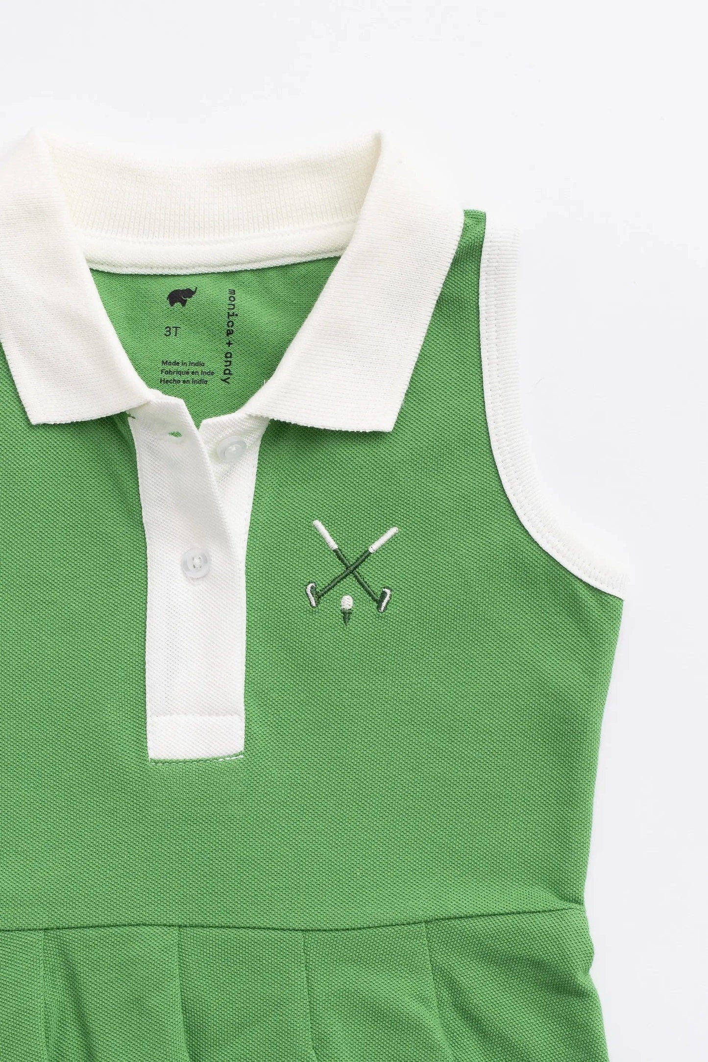 Golf Clubs on Green Pleated Tennis Dress